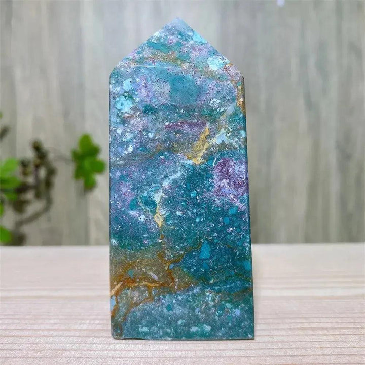 Polished blue Ocean Jasper tower with swirling orb patterns, moss agate druzy, and natural surface variations.