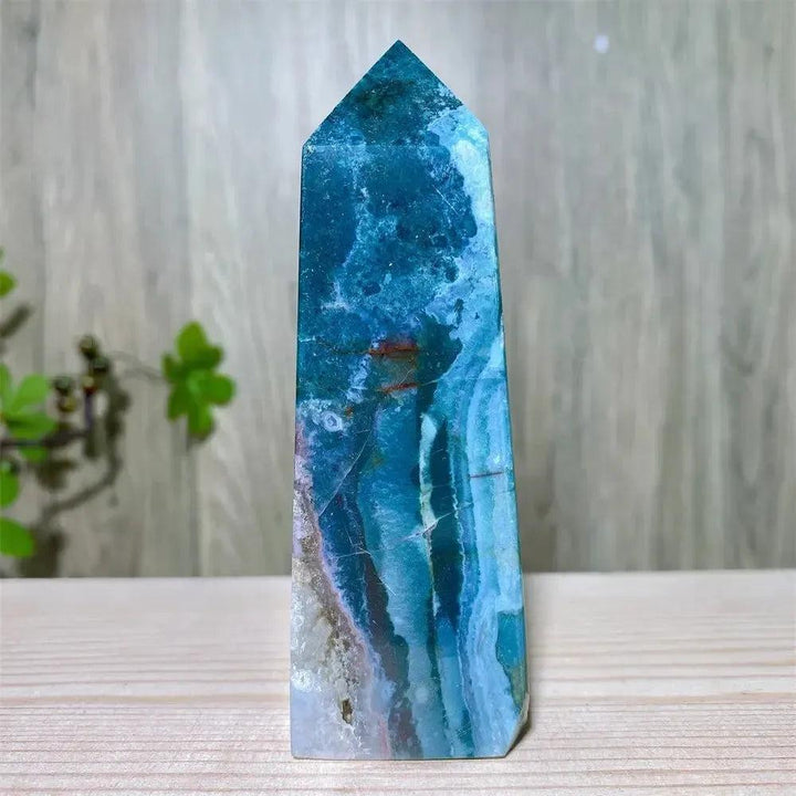 Polished blue Ocean Jasper tower with swirling patterns, moss agate druzy, and natural surface variations.