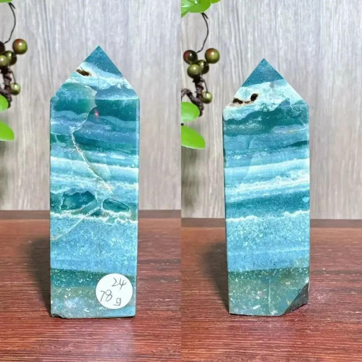Polished blue Ocean Jasper tower with swirling orb patterns, green tones, and natural druzy inclusions.