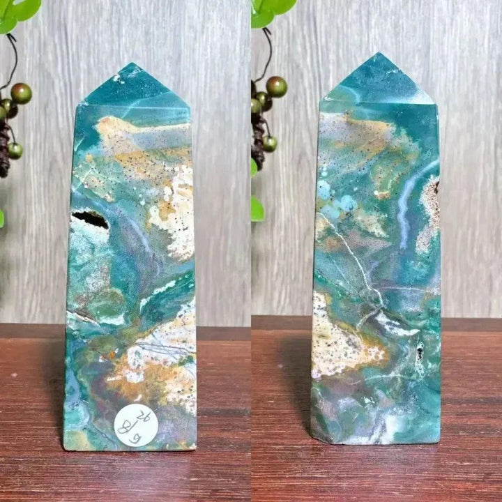 Polished blue Ocean Jasper tower with swirling blue, cream, and green patterns, featuring natural druzy inclusions.