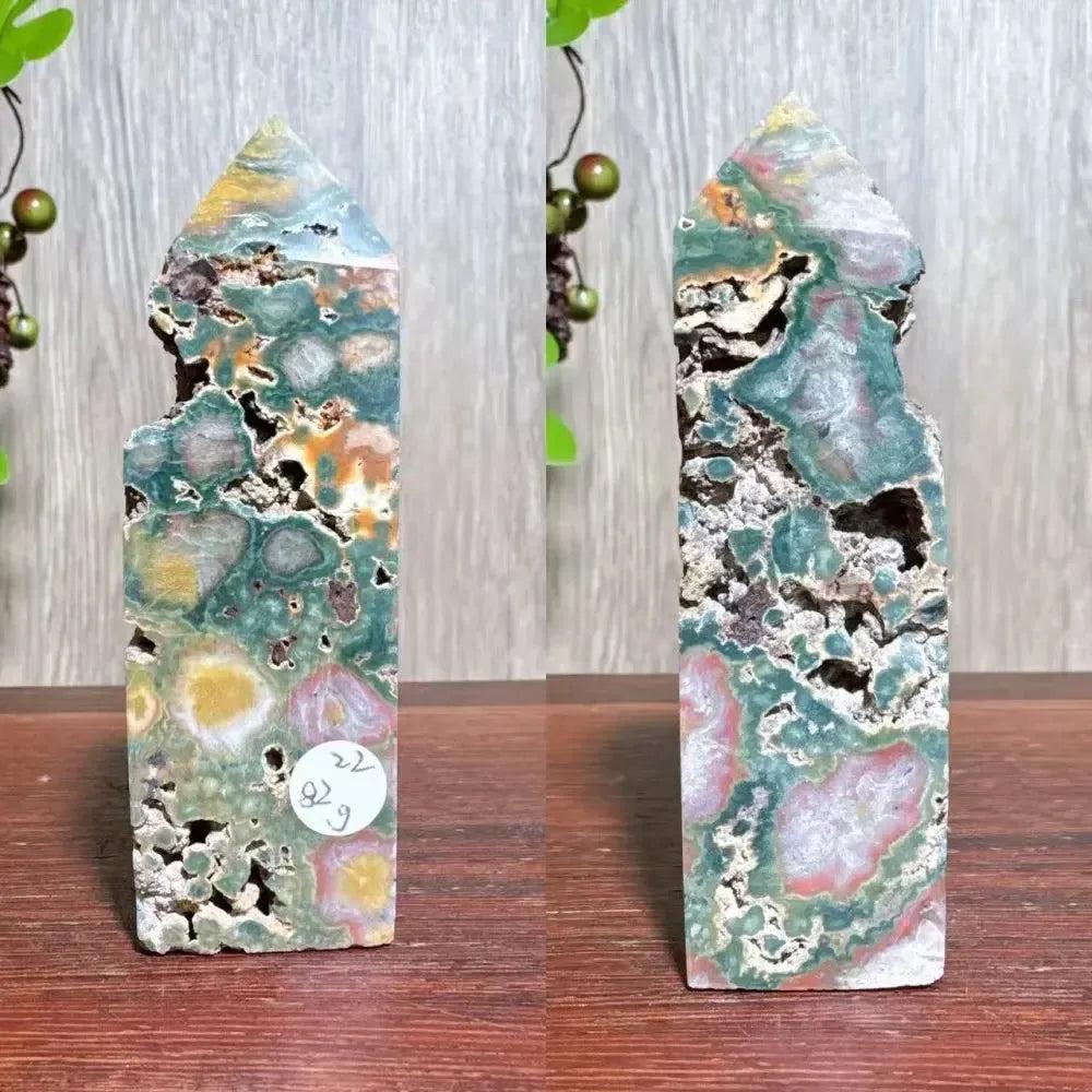 Polished Ocean Jasper tower with swirling blue, green, cream, and pink orb patterns, natural druzy pockets, and a pointed top.