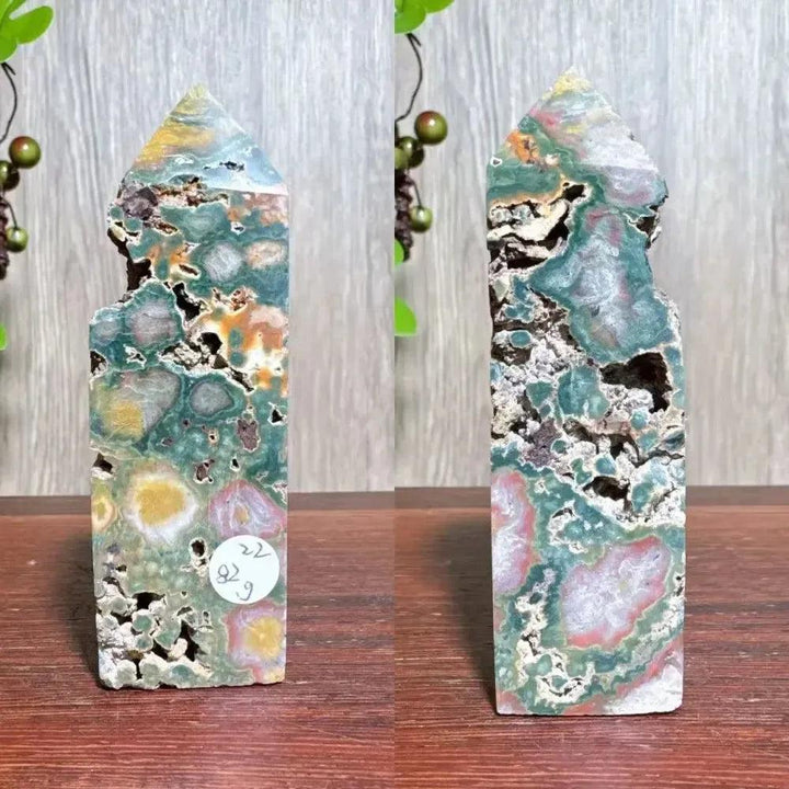 Polished Ocean Jasper tower with swirling blue, green, cream, and pink orb patterns, natural druzy pockets, and a pointed top.