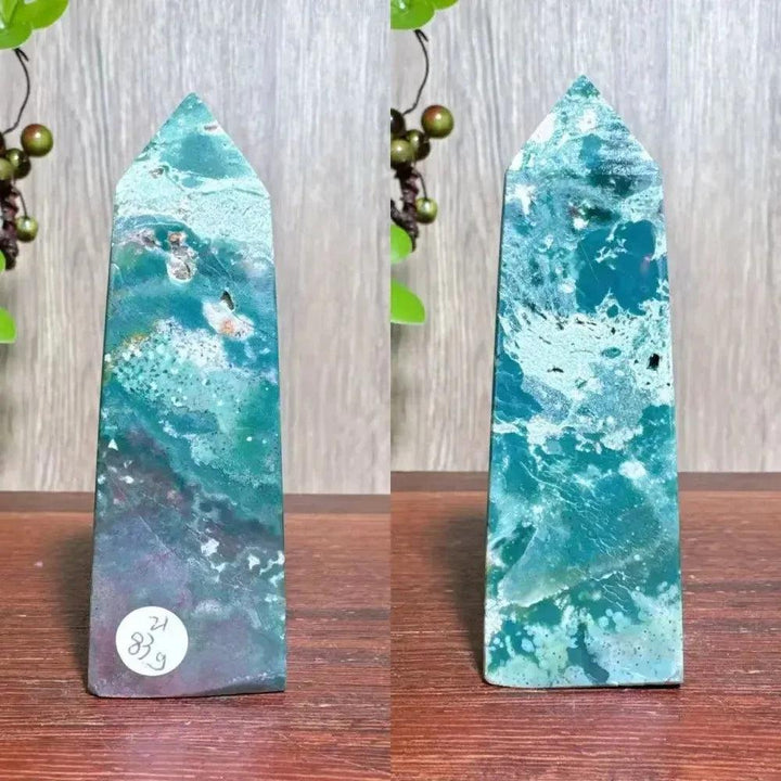 Polished blue Ocean Jasper tower with swirling orb patterns, moss agate druzy, and natural surface variations.
