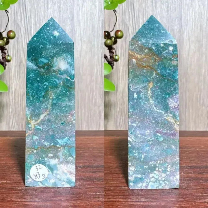 Polished blue Ocean Jasper tower with swirling patterns, moss agate druzy, and natural surface variations.