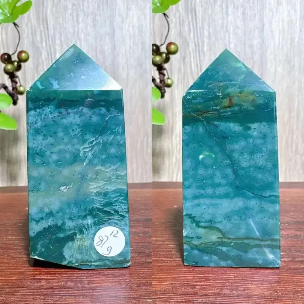 Polished blue Ocean Jasper tower with swirling patterns, moss agate druzy, and a pointed top. Supports Heart & Throat Chakras.