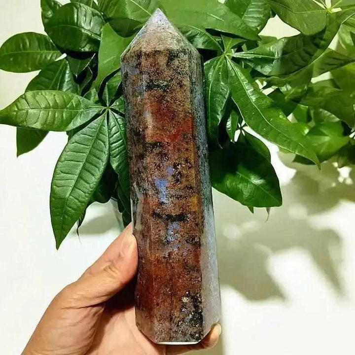 Polished Ocean Jasper tower point featuring earthy red and blue orbicular patterns for heart and throat chakra healing.