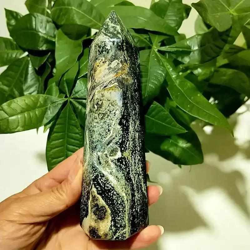 Polished Ocean Jasper tower point featuring dark green orbicular patterns for Heart Chakra healing and calm display.