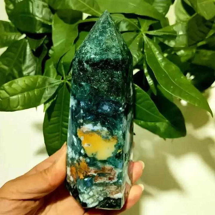 Polished Ocean Jasper tower point featuring deep green hues, vibrant orbs, and bands for heart chakra healing and display.