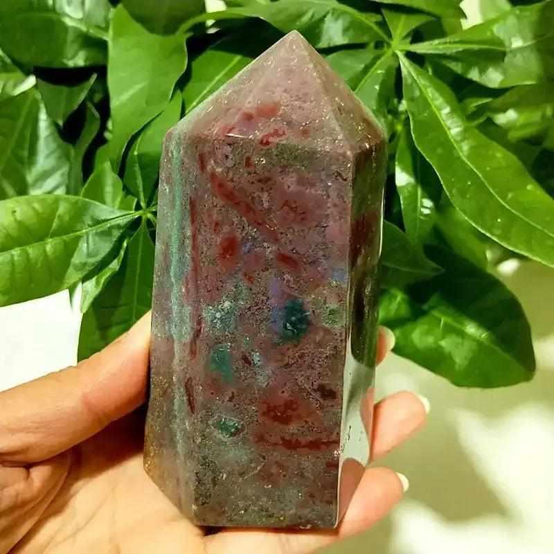 Polished Ocean Jasper tower point featuring earthy red and green orbicular patterns for Heart Chakra healing and display.