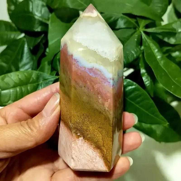 Polished Ocean Jasper tower point featuring earthy bands and calming energy, perfect for heart chakra meditation.