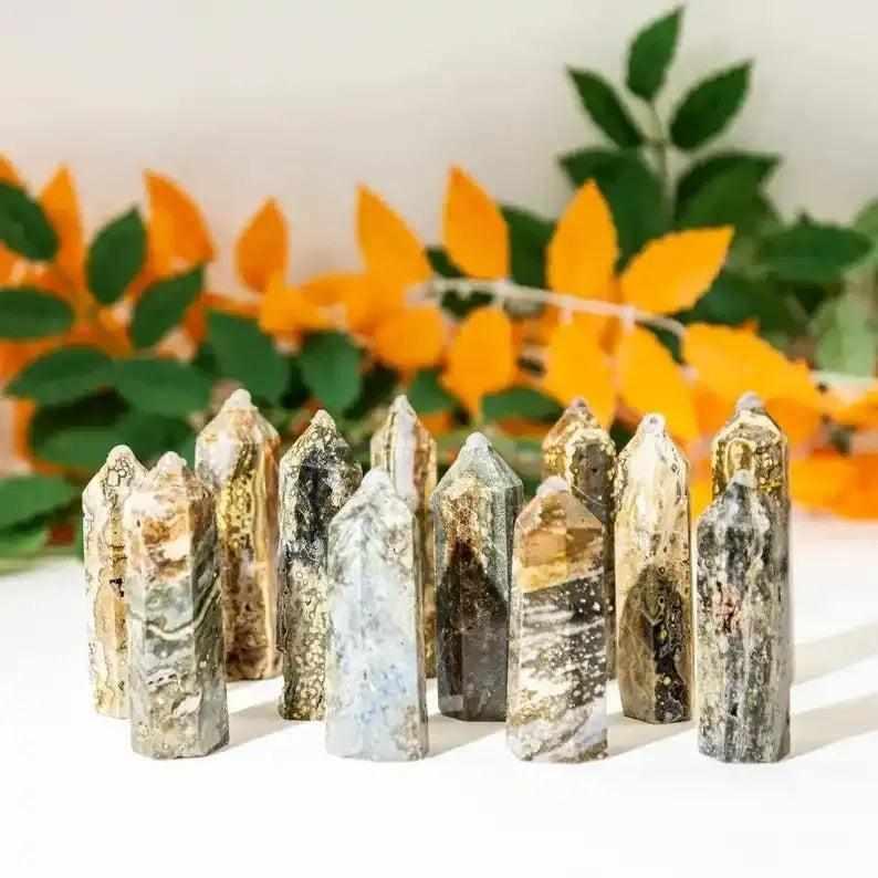 Polished Ocean Jasper towers featuring calming green, cream, and pink orb patterns for heart chakra healing and decor.