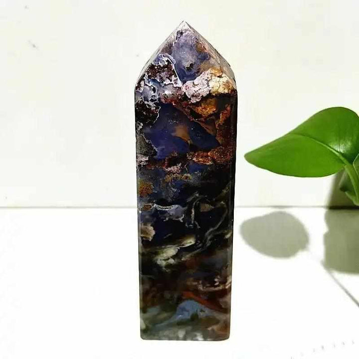 Polished Ocean Jasper tower wand featuring deep blue, cream, and earthy orb patterns for heart and throat chakra healing.