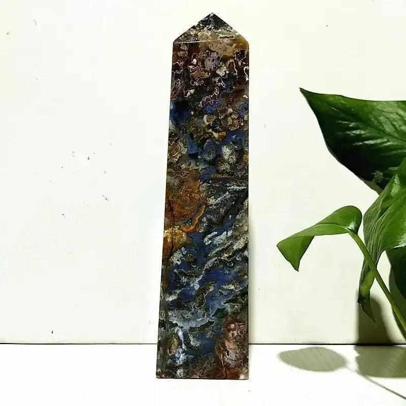 Polished Ocean Jasper tower wand featuring intricate blue, brown, and cream orb patterns for heart chakra healing.