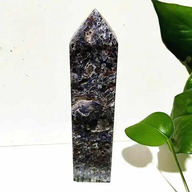 Polished Ocean Jasper tower wand featuring intricate orb patterns in deep sea tones for heart and throat chakra healing.