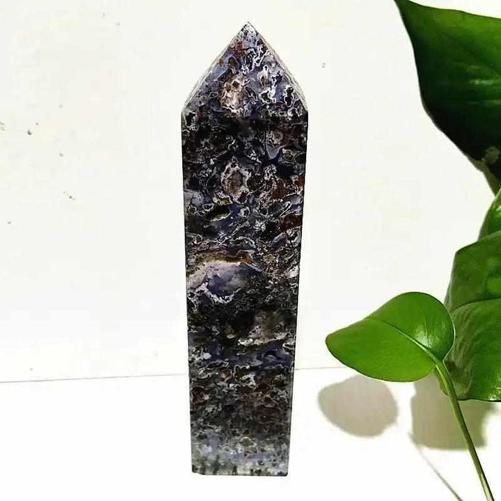 Polished Ocean Jasper tower wand featuring intricate orb patterns in deep sea tones for heart and throat chakra healing.