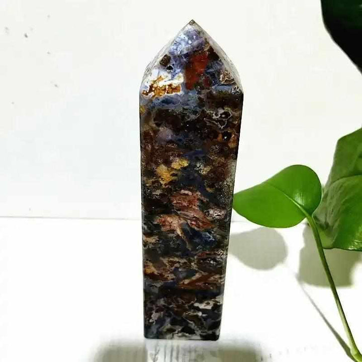 Polished Ocean Jasper tower wand featuring deep blue, brown, and cream orb patterns for heart and throat chakra healing.