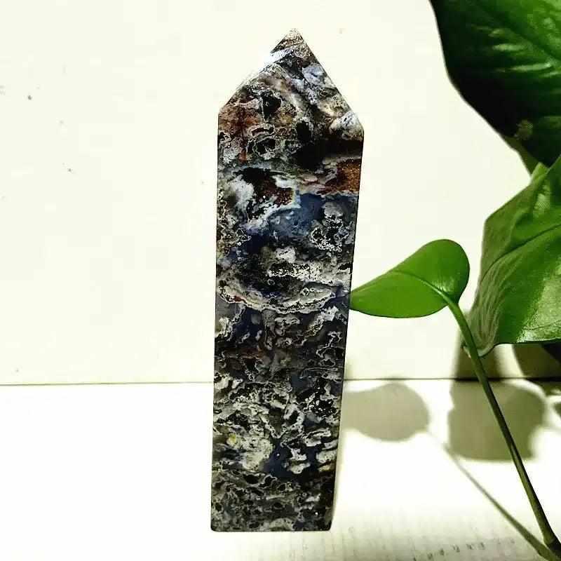 Polished Ocean Jasper tower wand featuring intricate blue, cream, and brown orb patterns for heart chakra healing.