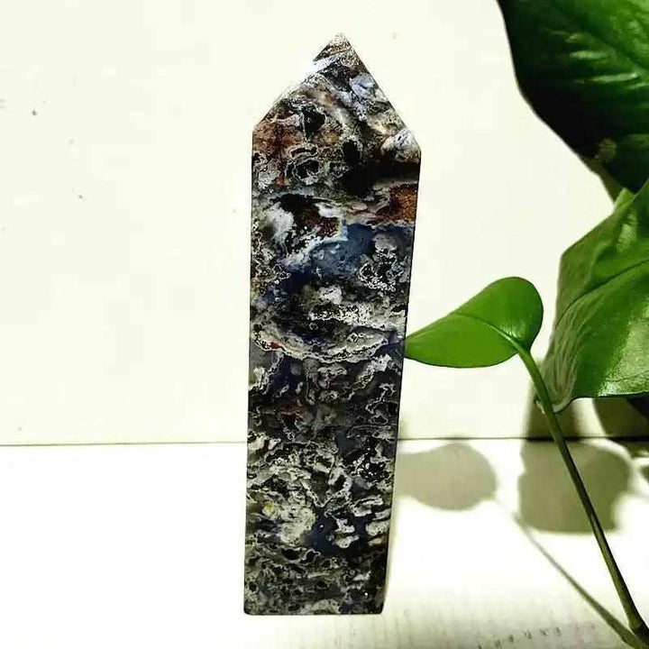Polished Ocean Jasper tower wand featuring intricate blue, cream, and brown orb patterns for heart chakra healing.
