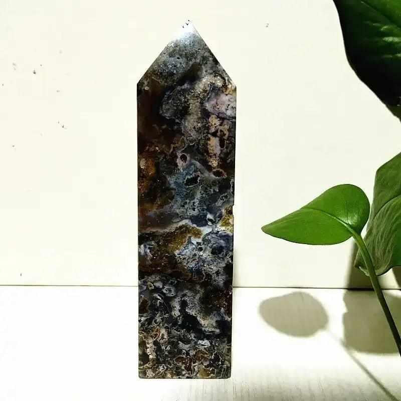 Polished Ocean Jasper tower wand featuring intricate sea green, cream, and pink orb patterns for heart chakra healing.