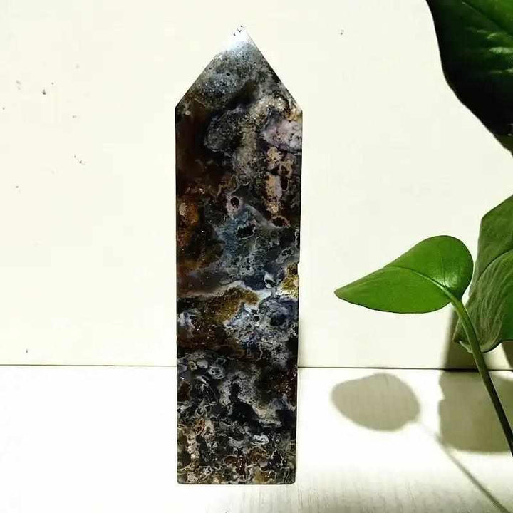 Polished Ocean Jasper tower wand featuring intricate sea green, cream, and pink orb patterns for heart chakra healing.
