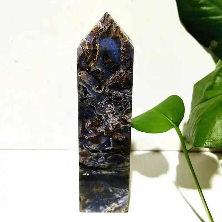 Polished Ocean Jasper tower wand featuring deep blue, cream, and brown orb patterns for Heart and Throat Chakra healing.