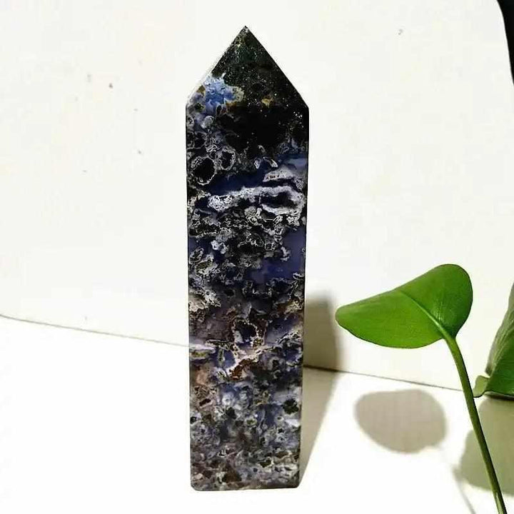 Polished Ocean Jasper tower wand featuring intricate blue and cream orb patterns for Heart and Throat Chakra healing.