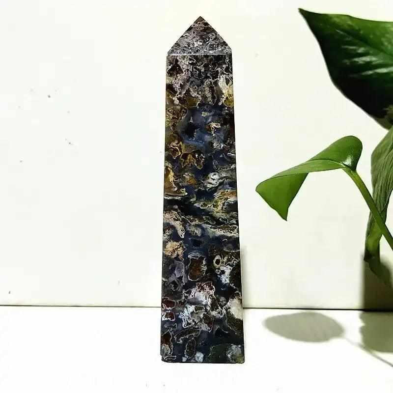 Polished Ocean Jasper tower wand featuring intricate orb patterns in deep sea green, cream, and pink for heart chakra healing.