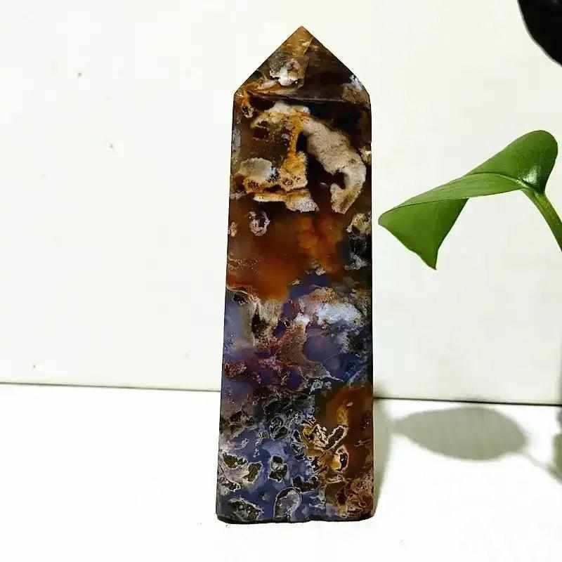 Polished Ocean Jasper tower wand featuring intricate sea green, cream, and pink orb patterns for heart chakra healing.