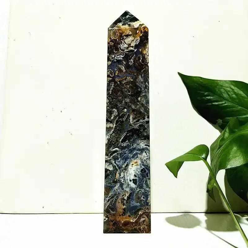 Polished Ocean Jasper tower wand featuring intricate sea green, cream, and pink orb patterns for heart chakra healing.