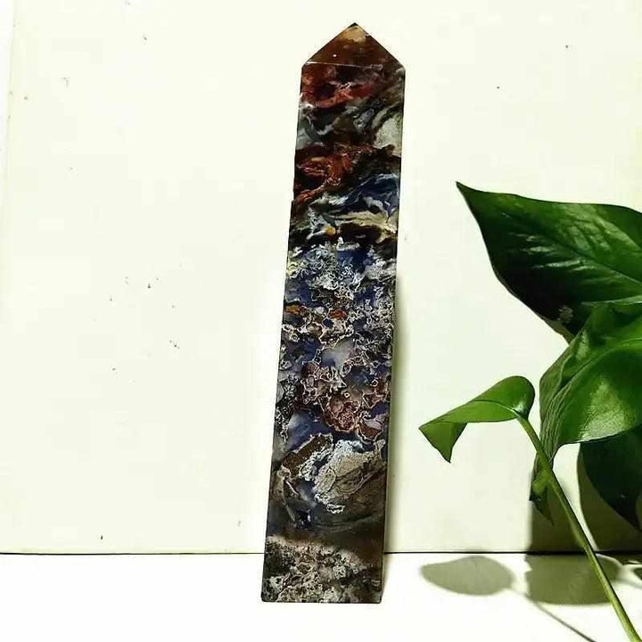Polished Ocean Jasper tower wand featuring intricate sea green, cream, and pink orb patterns for heart chakra healing.