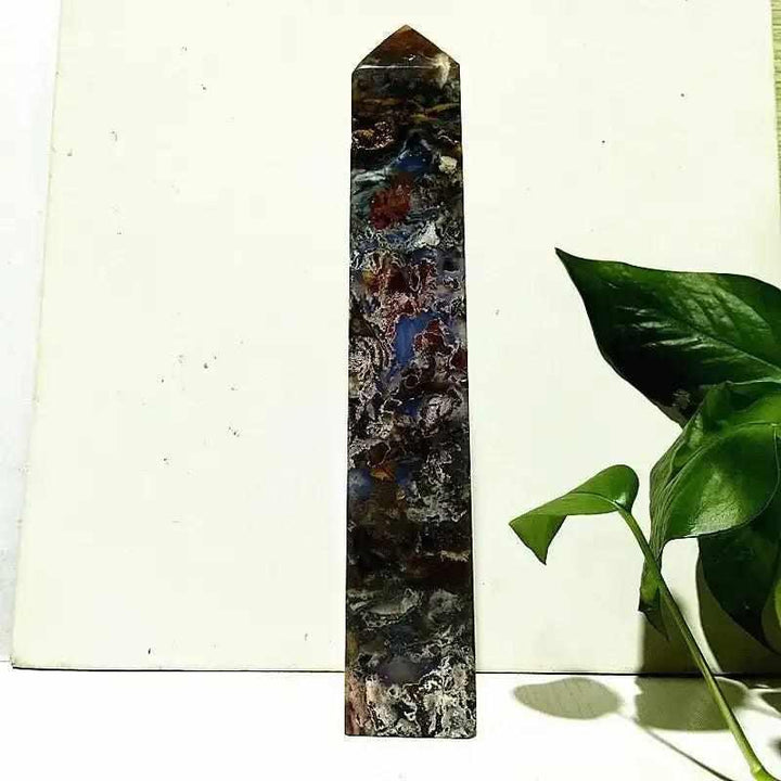 Polished Ocean Jasper tower wand featuring intricate sea green, cream, and pink orb patterns for heart chakra healing.