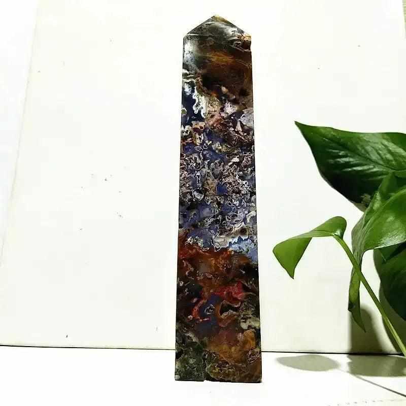 Polished Ocean Jasper tower wand featuring intricate orb patterns in sea green, cream, and pink for heart chakra healing.