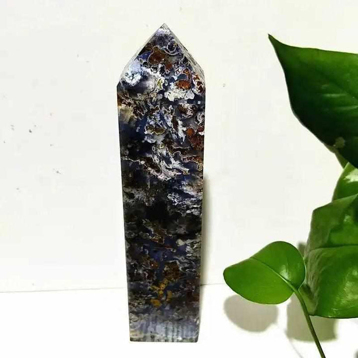 Polished Ocean Jasper tower wand featuring intricate blue, brown, and cream orb patterns for heart chakra healing.