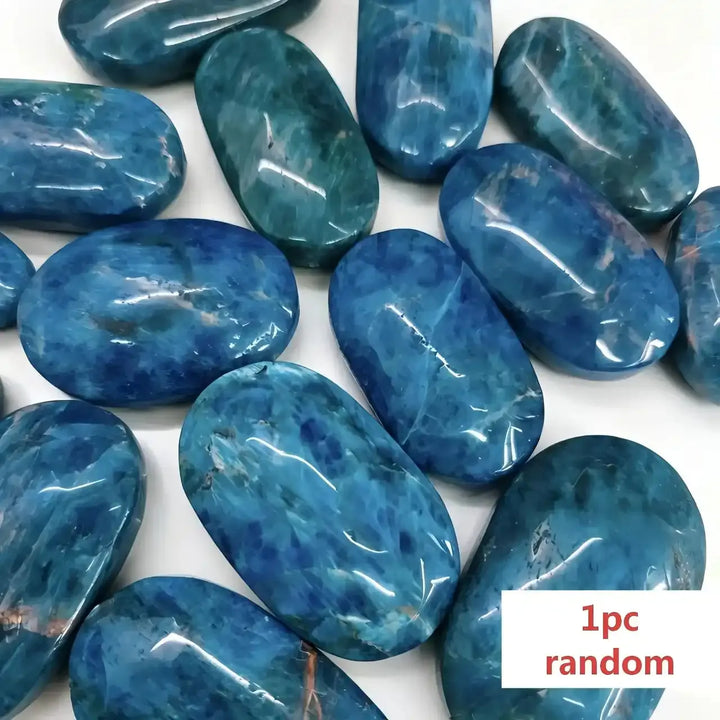 Polished blue apatite palm stone with deep ocean hues, a smooth natural crystal perfect for healing and home decor.