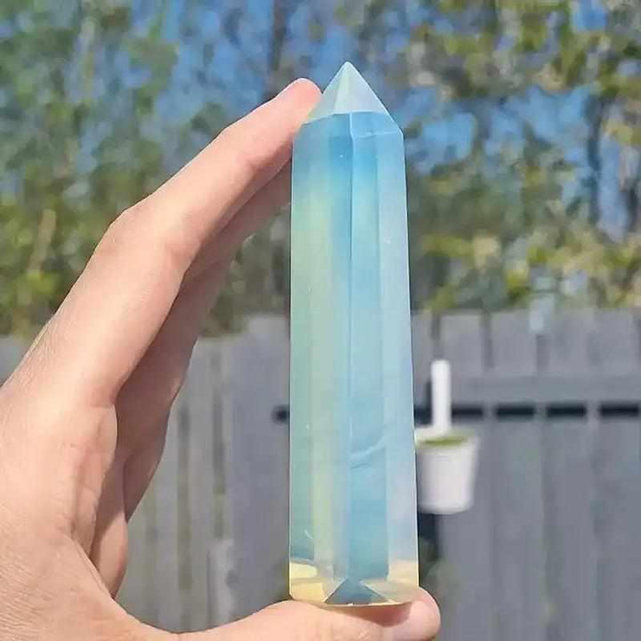 Polished opalite obelisk tower with a milky blue shimmer, perfect for Third Eye Chakra meditation and altar decor.