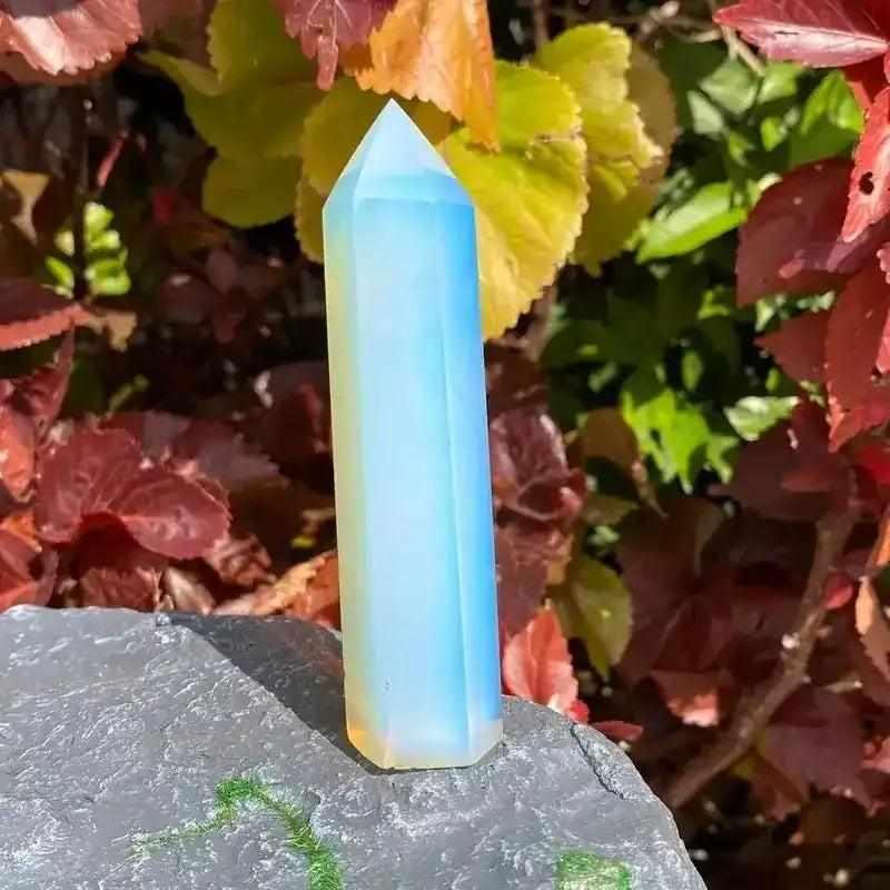 Polished opalite obelisk tower with a milky, iridescent blue glow, perfect for Third Eye Chakra meditation and altar decor.