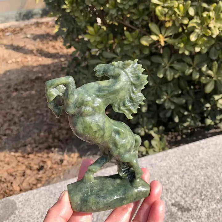 Hand-carved Ophiolite crystal horse sculpture with deep green tones, polished to a liquid shine for grounding energy.