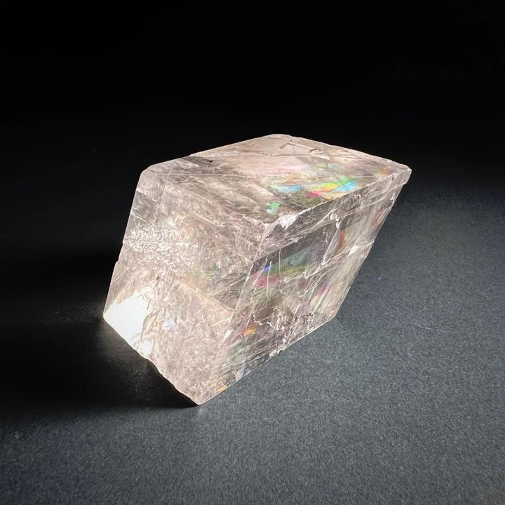 Clear Brazilian Optical Calcite cube with rainbow refractions, ideal for home decor and promoting clarity.