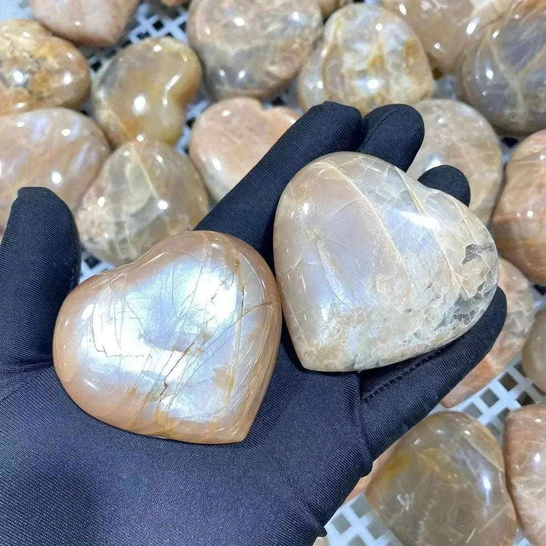 Crystal Destiny's radiant orange moonstone heart, glowing with peachy-orange tones and iridescent shimmer.