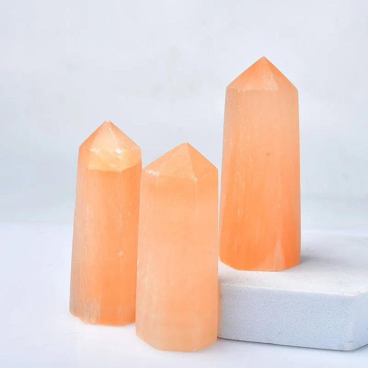 Three orange selenite crystal points, 60-70mm, for healing, decor, and energy.