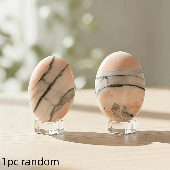 Polished Orange Sunstone Crystal Palm Stones with black veins on clear stands for vitality.