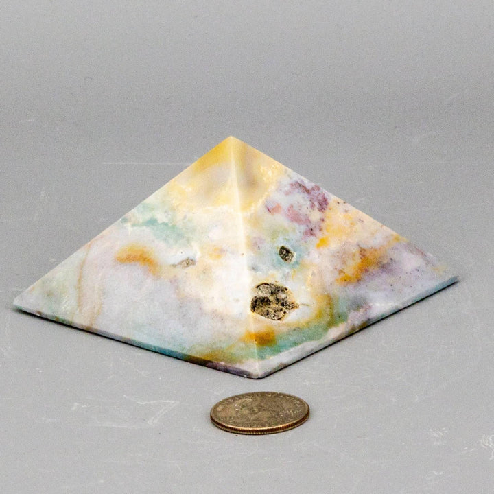 Pastel Calcite Crystal Pyramid with soft mint, peach, and honey hues for mental clarity and emotional balance.