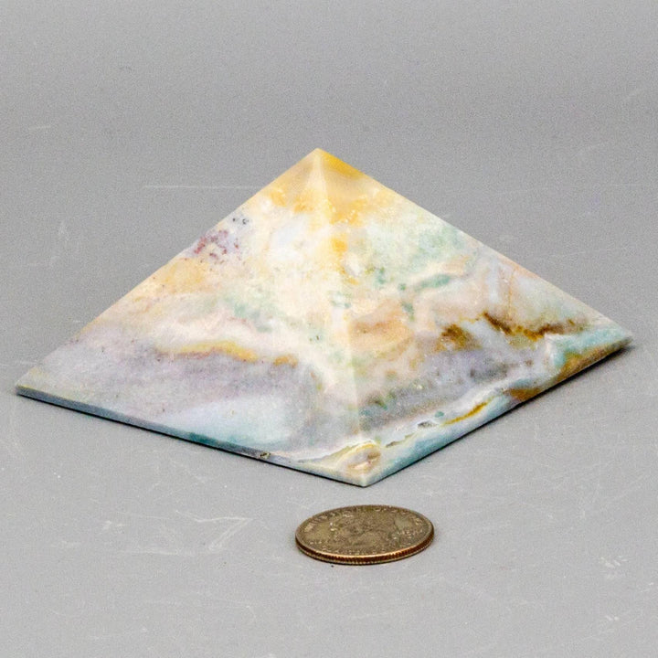 Pastel Calcite Crystal Pyramid with soft mint, peach, and honey hues for mental clarity and emotional balance.