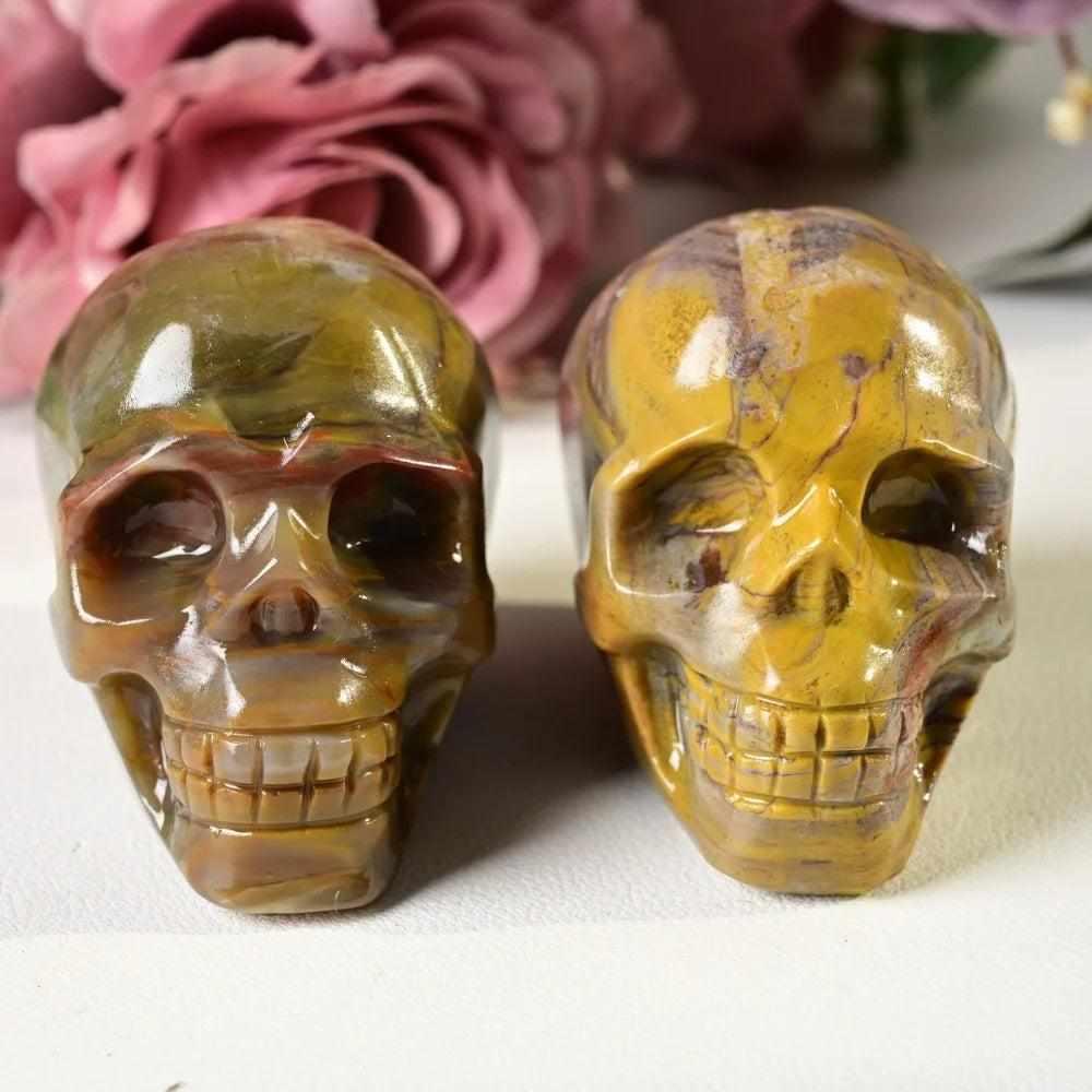 60mm hand-carved petrified wood skull with warm brown and tan grain, a grounding root chakra fossil for your collection.