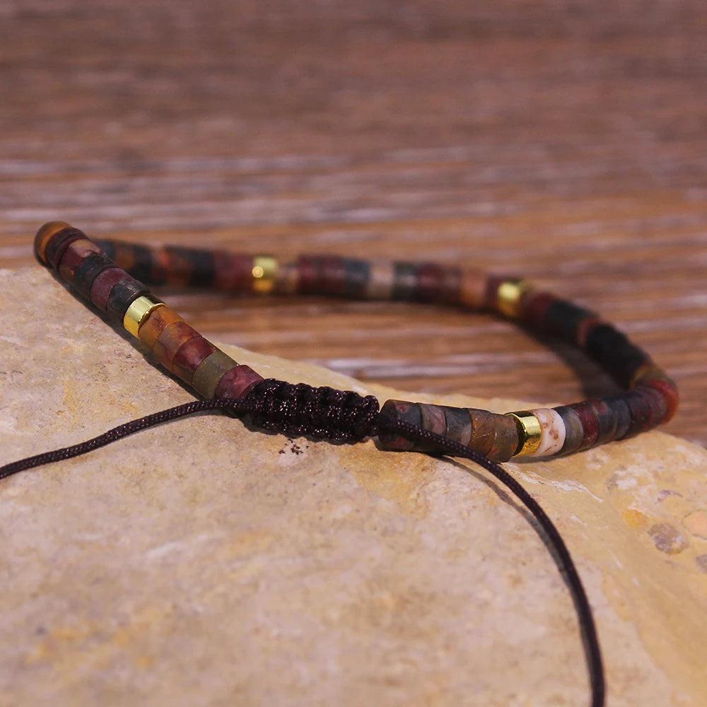 Picasso Jasper Crystal Beaded Adjustable Woven Bracelet with dark, sweeping markings and gold accents, offering grounding & stability.