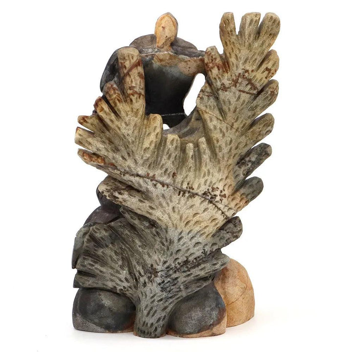 Hand-carved Picasso Jasper crystal statue, earthy browns and creams, depicting a stylized eagle or phoenix.