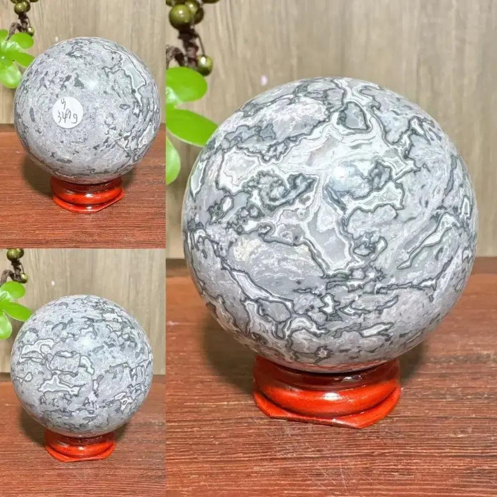 Polished Picasso Jasper Sphere with abstract gray, black, brown, and cream patterns, promoting creativity and grounding.