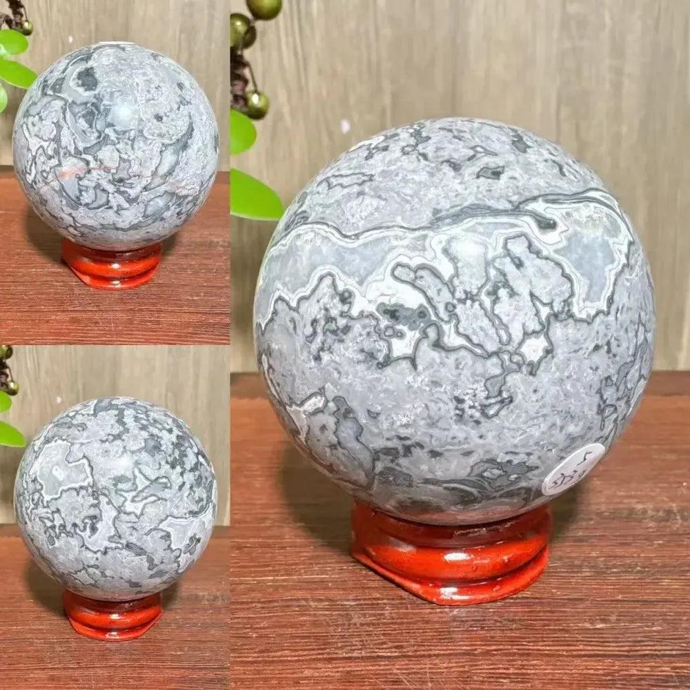 Polished Picasso Jasper Sphere with abstract gray, black, brown, and cream patterns, promoting creativity and grounding.