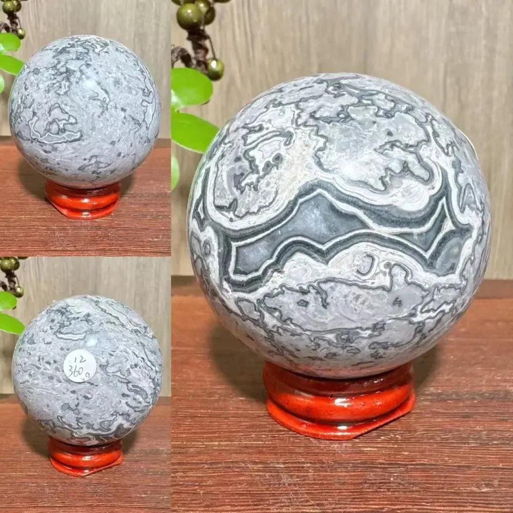 Polished Picasso Jasper Sphere with abstract gray, black, brown, and cream patterns, promoting creativity and grounding.