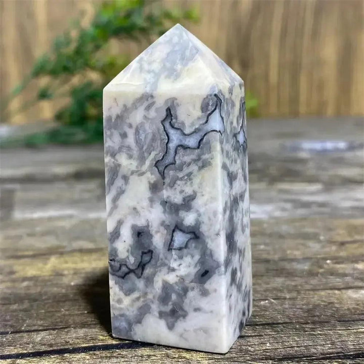 Picasso Stone Crystal Tower: grounding root chakra stone with bold black brushstrokes on warm cream and tan.